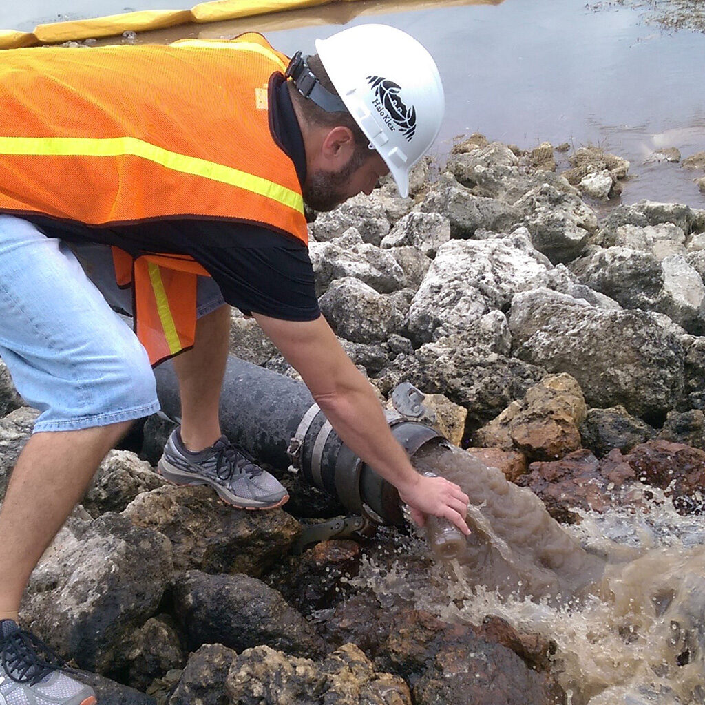 Ken collecting dirty water